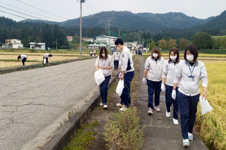 Employees cleaning up the area
